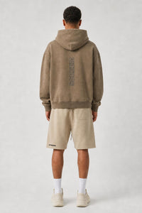 Model wearing SCREEM shorts with camel full-zip hoodie, back view