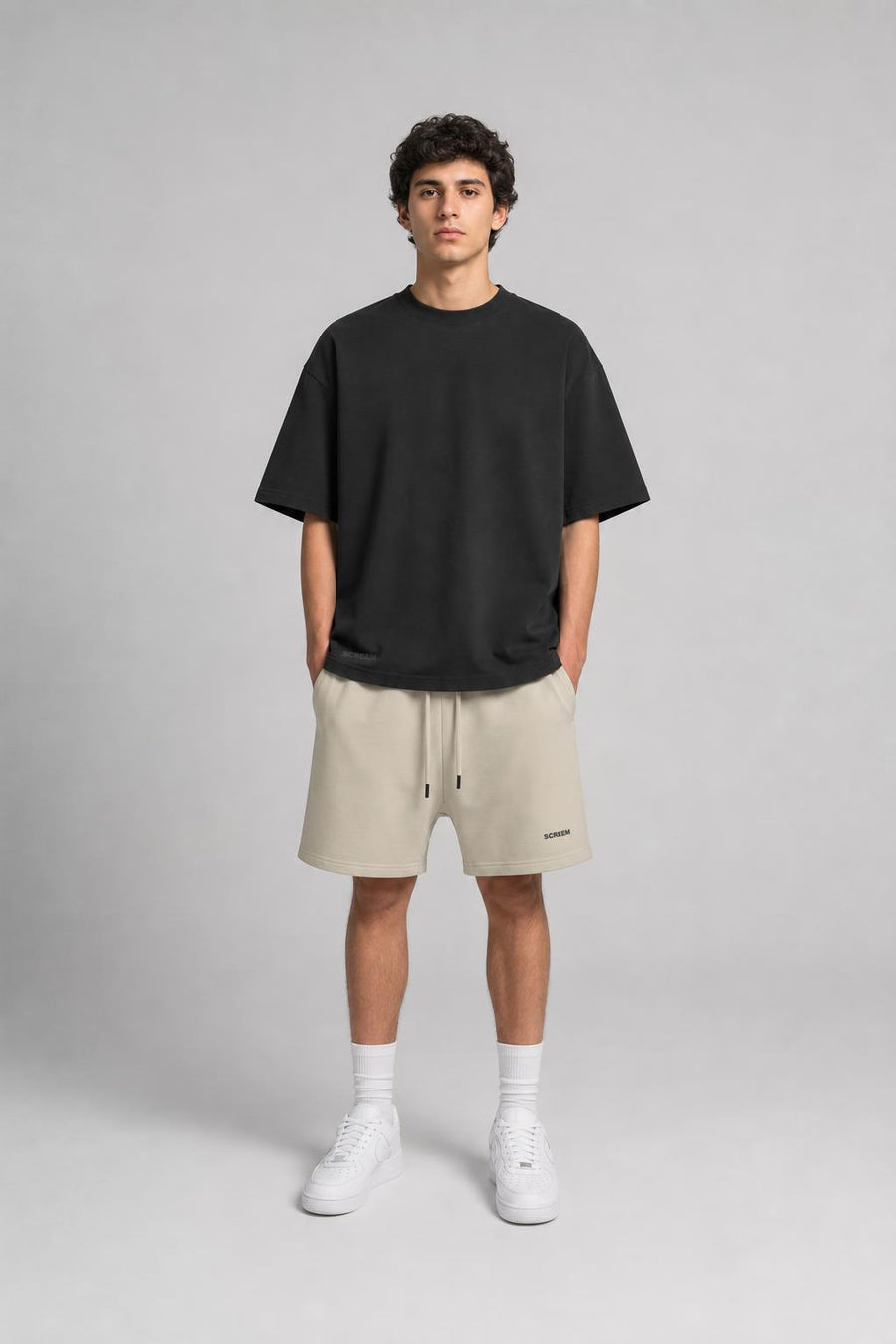 Model wearing SCREEM Washed Tee and shorts, front view